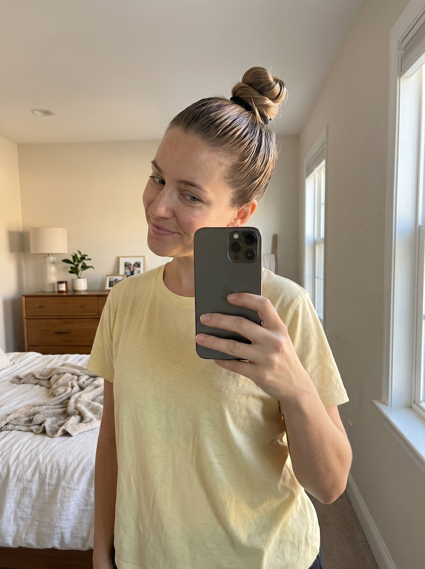 Effortless wet-look jelly knot updo with holographic highlights, a sultry summer hair updo 2026 for beach days or festivals, created with high-shine oil and pomade.