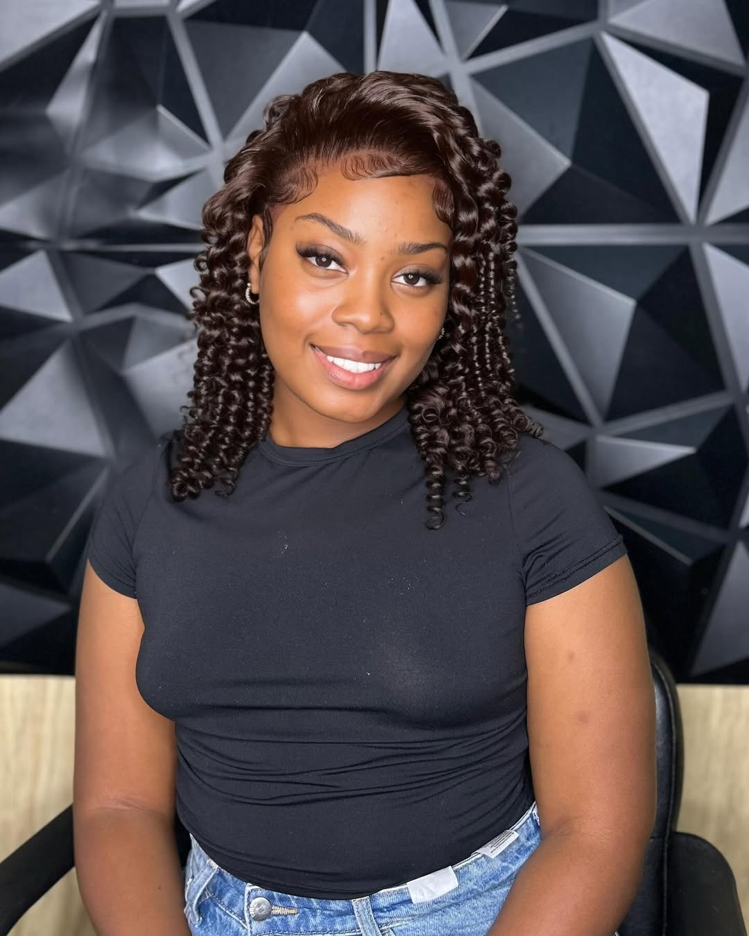 Close-up of a Black woman confidently showcasing a sleek, high ponytail with braided edges, perfect for summer hairstyles black women 2026.