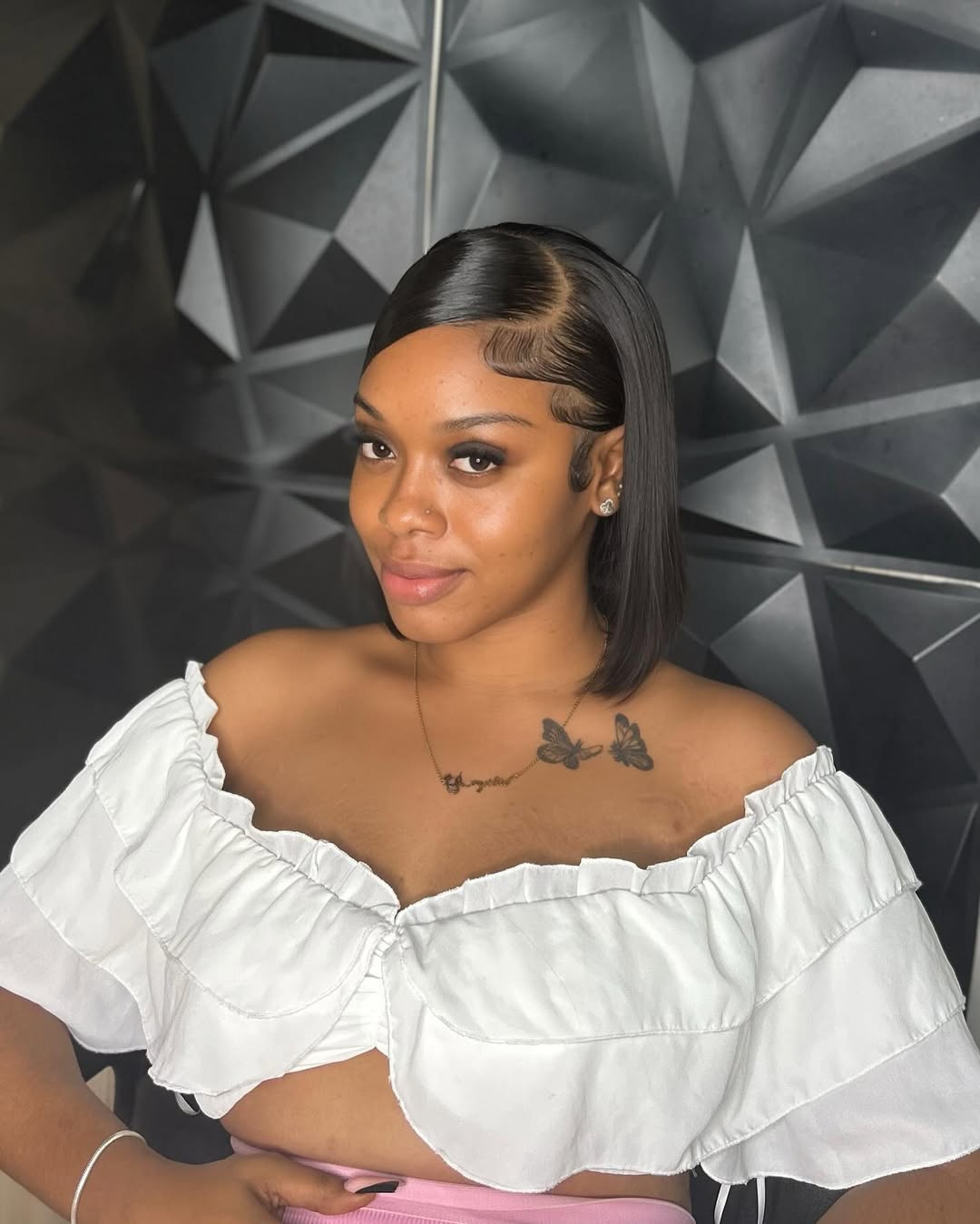 A stunning black woman showcasing a beautiful curly updo, perfect for summer hairstyles black women 2026. The hair is neatly pulled up, highlighting her elegant neck and face, suitable for a chic evening event or a casual summer day.
