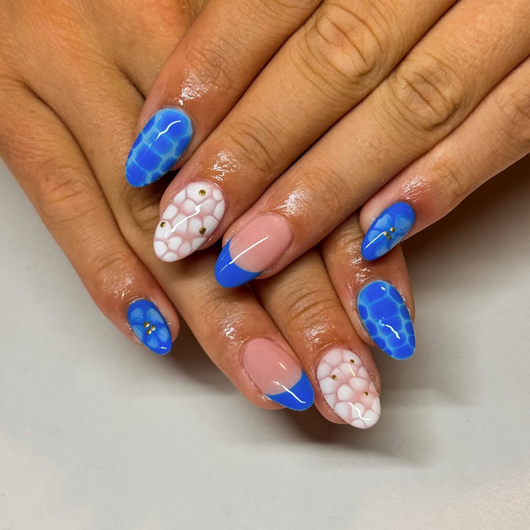 Vibrant Blue French Tips with Aquatic and Floral Accents