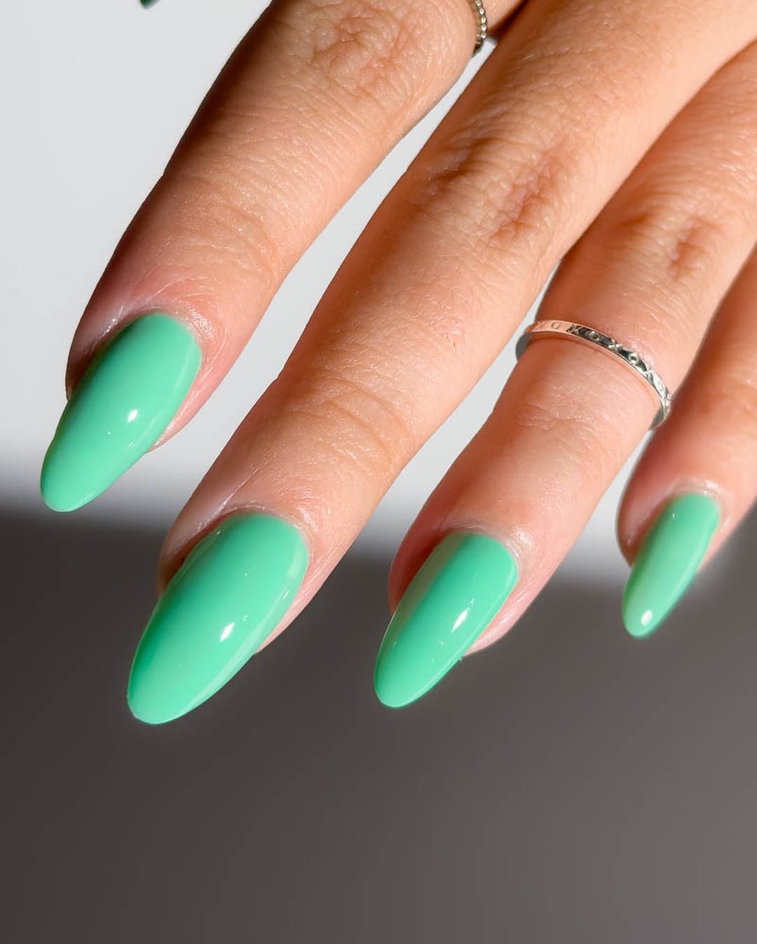 Vibrant Glossy Mint Green Almond Nails