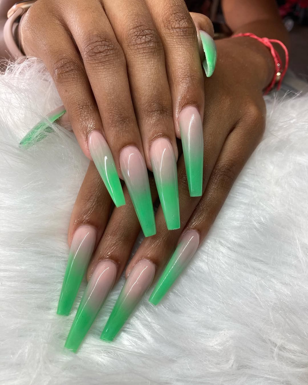 Vibrant Green Ombre Coffin Nails with Milky Base