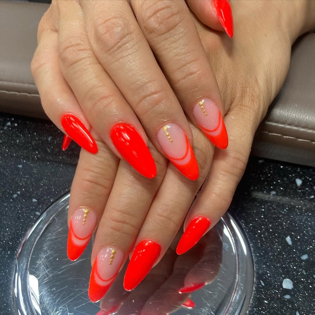 Vibrant Neon Orange Almond French Tips with Gold Accents