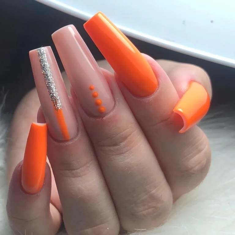 Vibrant Orange and Nude Coffin Nails with Glitter Accents