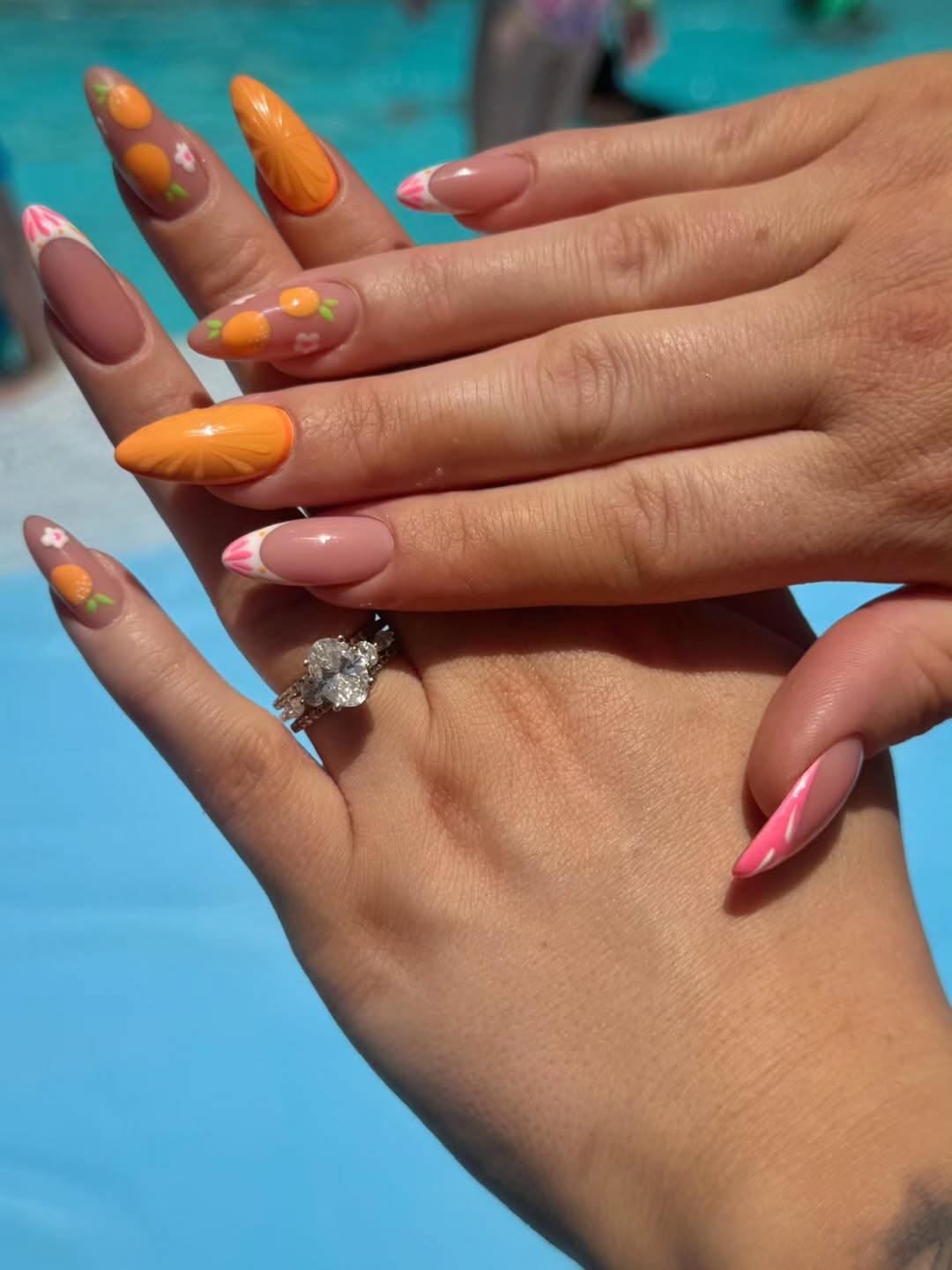 Vibrant Orange Citrus French Tips with Floral Accents