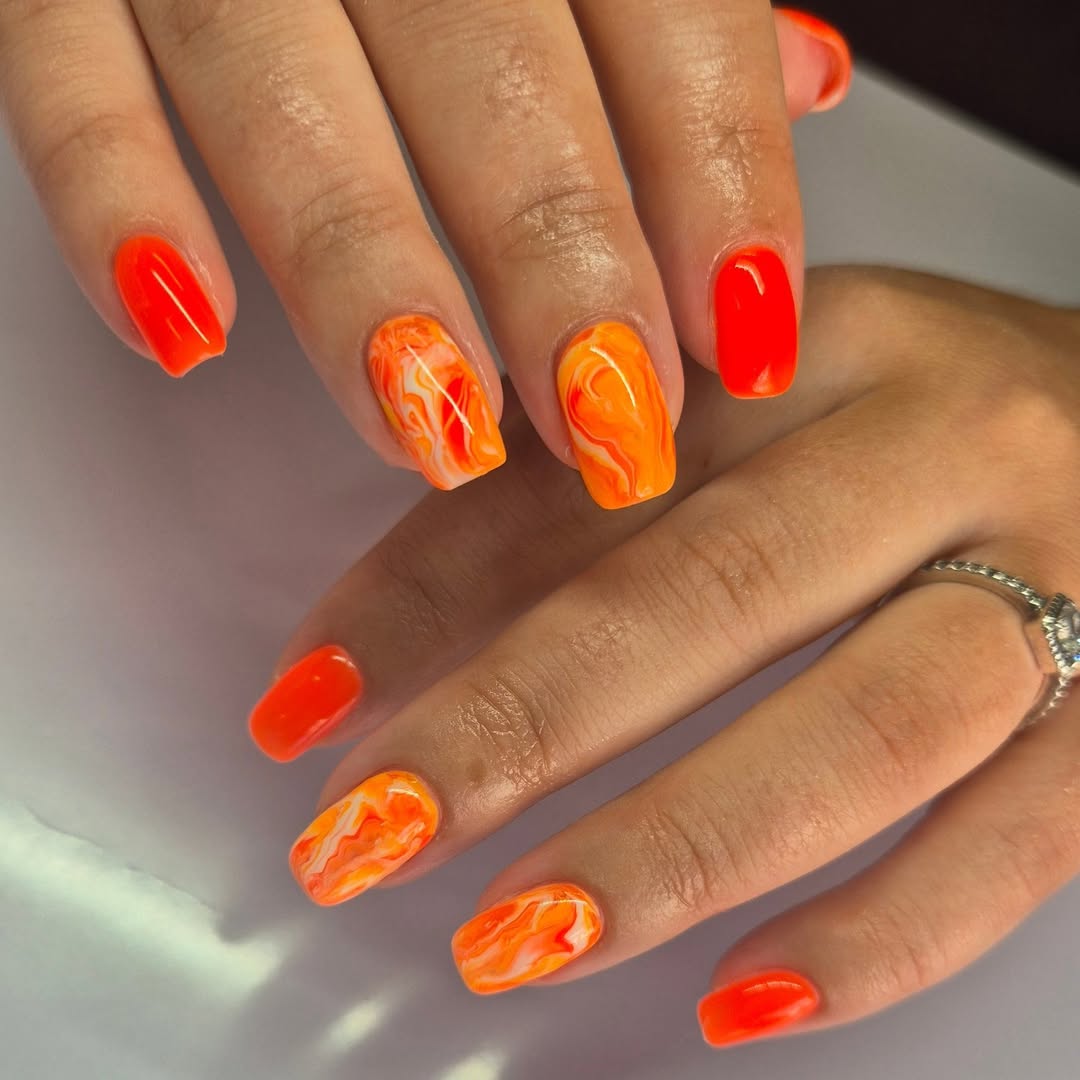 Vibrant Orange Swirl and Solid Short Squoval Nails