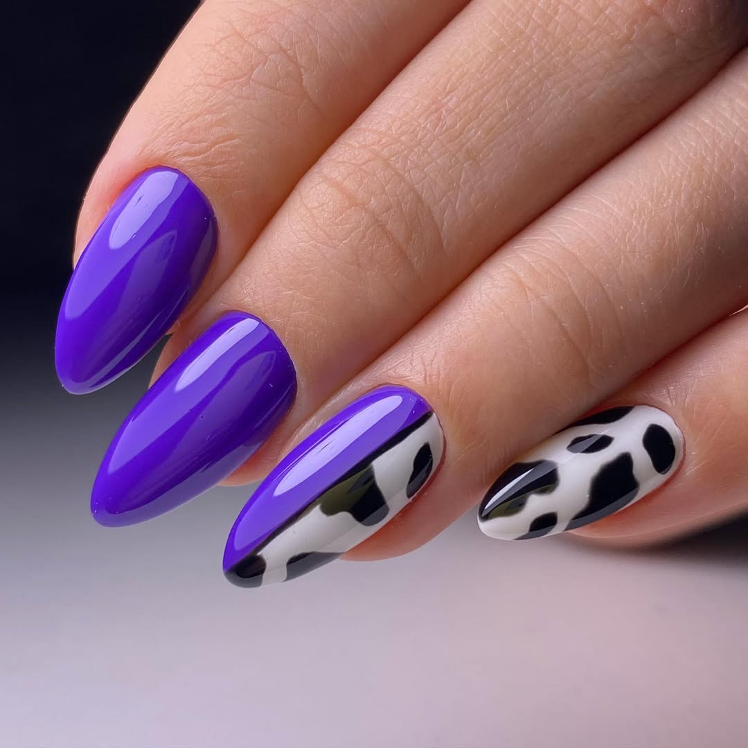 Vibrant Purple and Cow Print Almond Nails