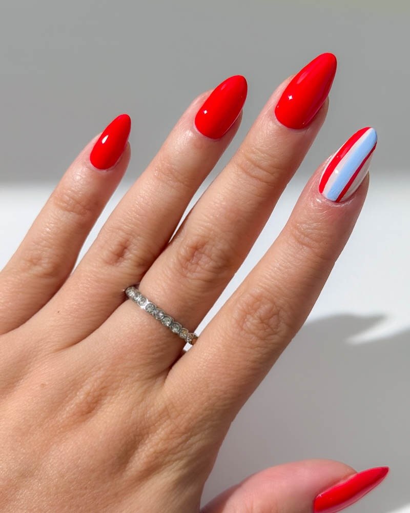 24 Red White Blue Nails You Need for 2026 12 Vibrant Red Almond Nails with Patriotic Accent