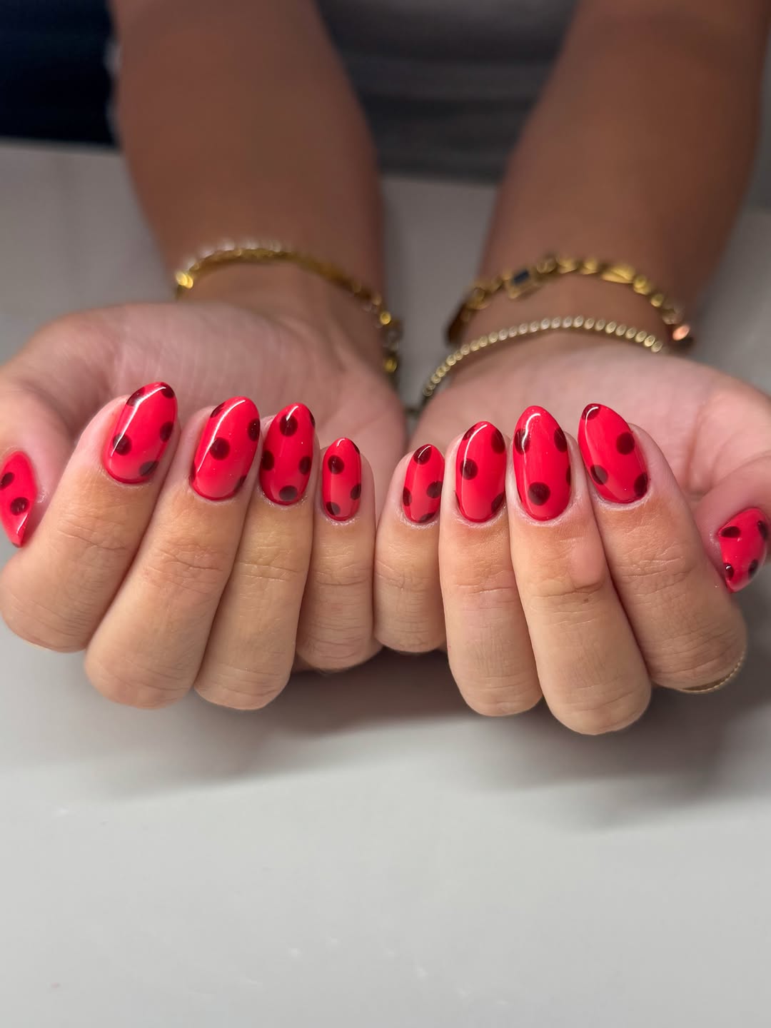 Vibrant Red Polka Dot Almond Nails