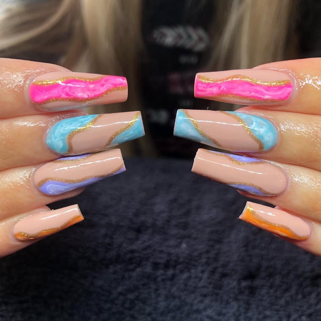 Vibrant Swirl Coffin Nails with Gold Glitter Accents