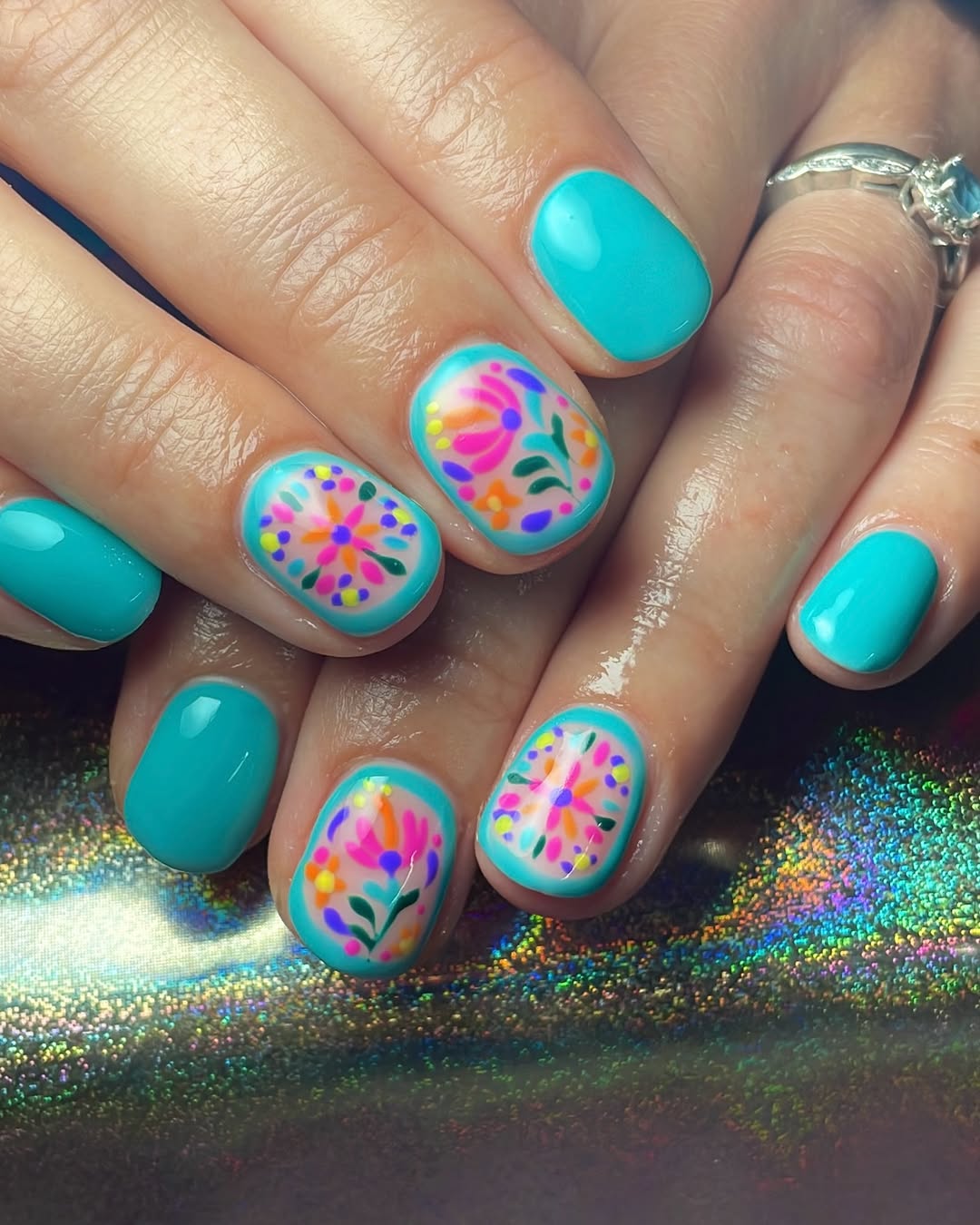 Vibrant Teal Floral Outline Nails