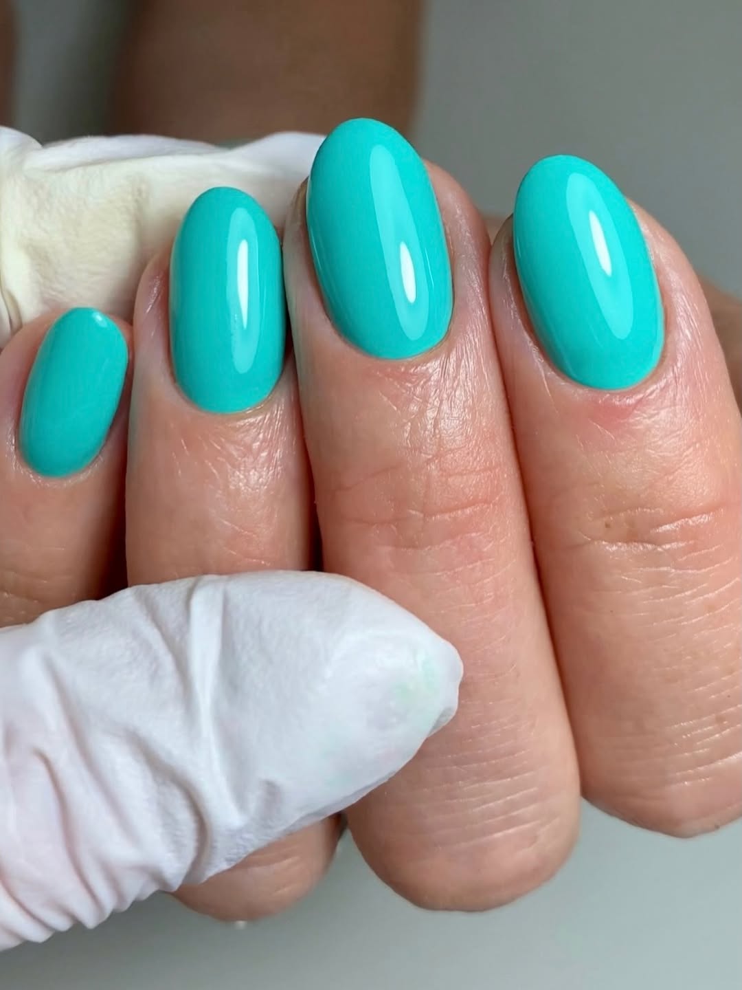 Vibrant Teal Glossy Oval Nails