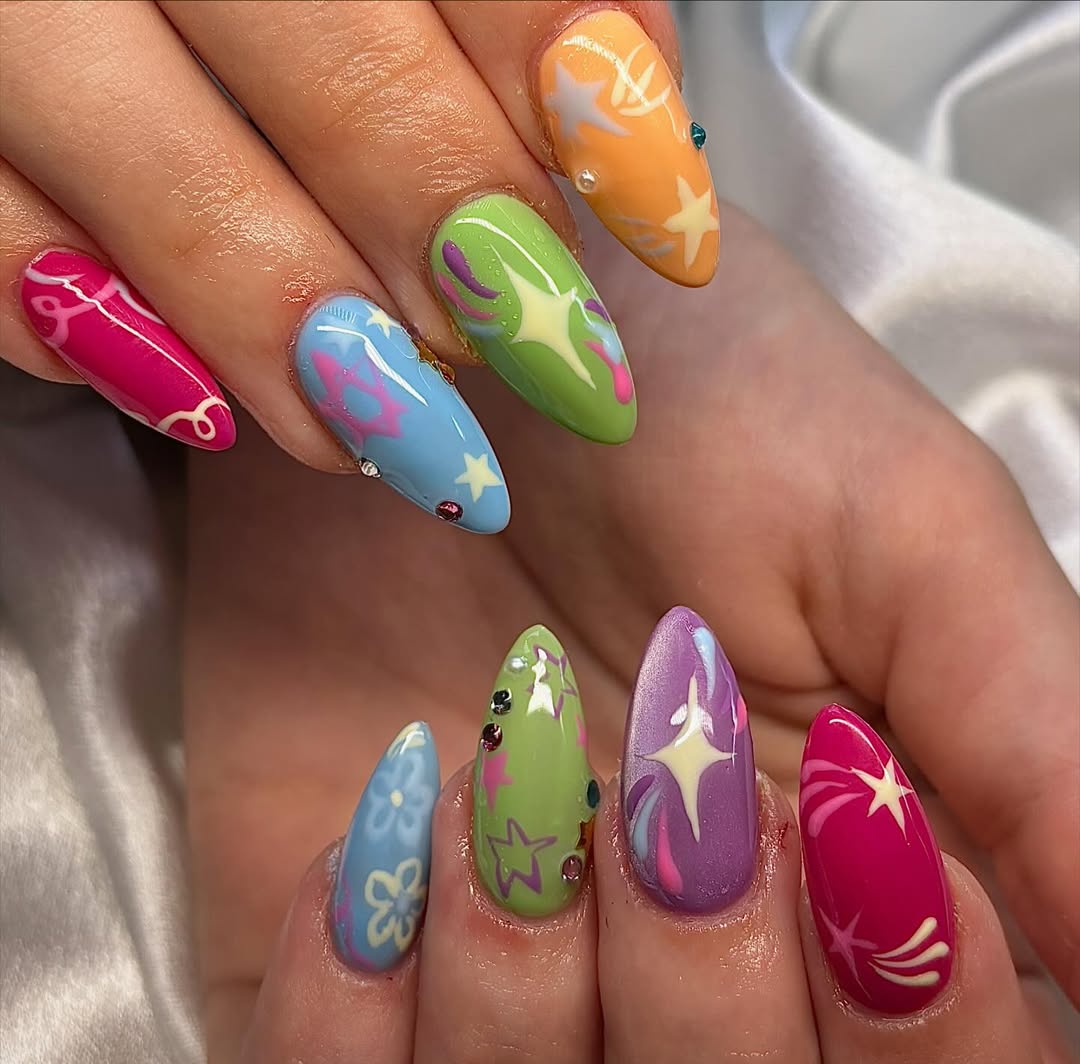 Vibrant Y2K Swirls and Stars Almond Nails with Rhinestones