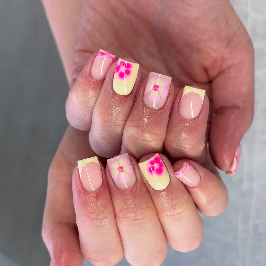 Vibrant Yellow French Tips With Pink Floral Accents