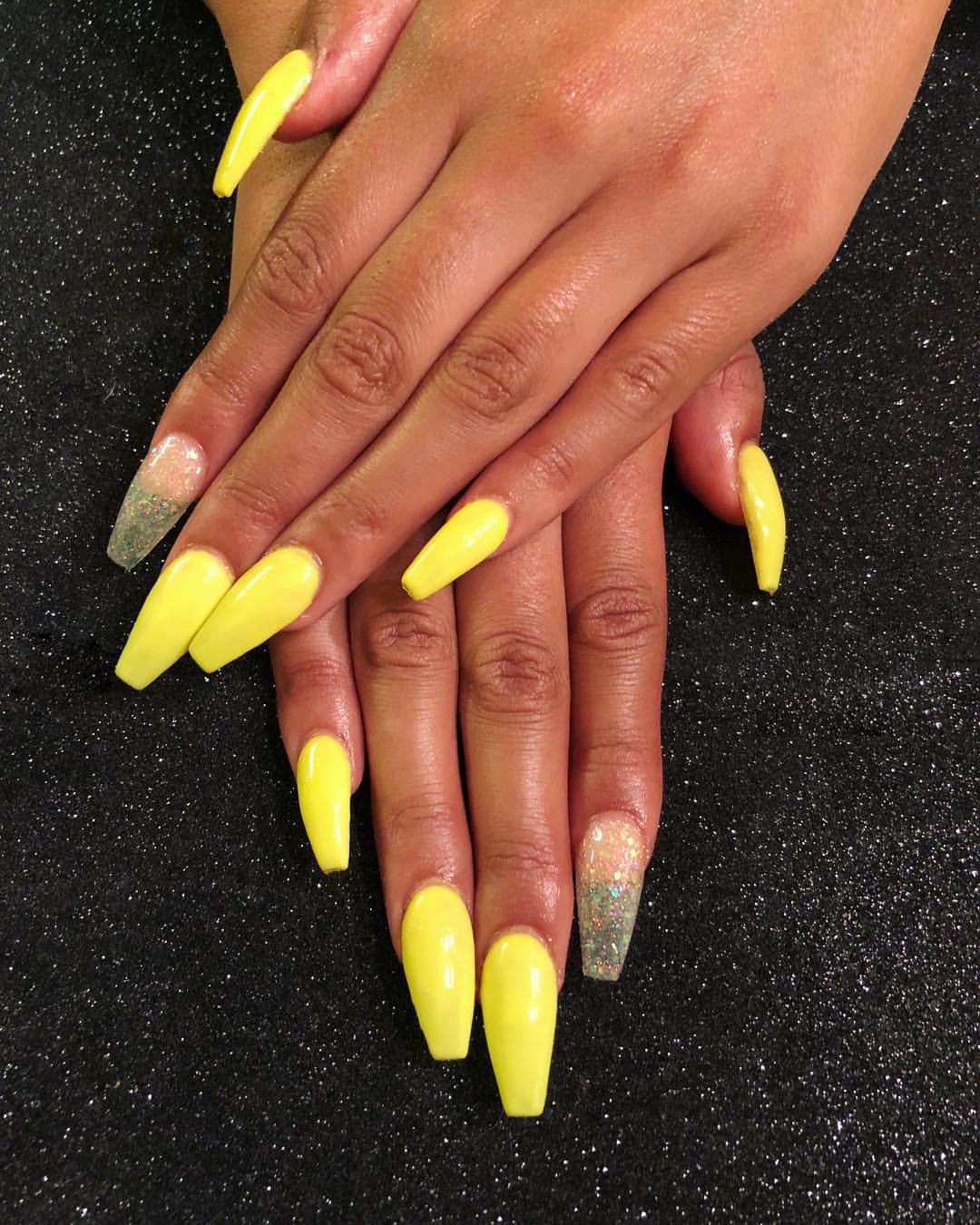 Vibrant Yellow Glossy Coffin Nails with Glitter Accent
