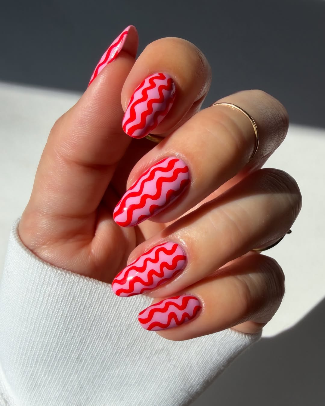 Wavy Hot Pink and Bright Coral Swirl Nails