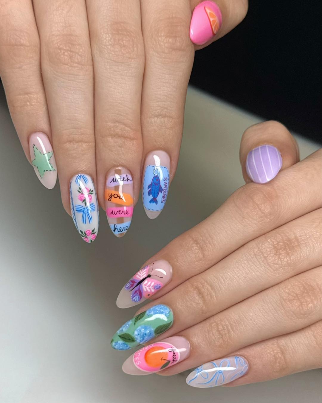 Whimsical Hand-Painted Almond Nail Art