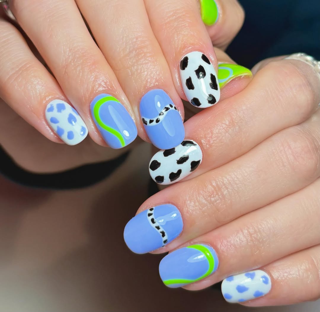 Whimsical Periwinkle Cow Print Short Oval Nails