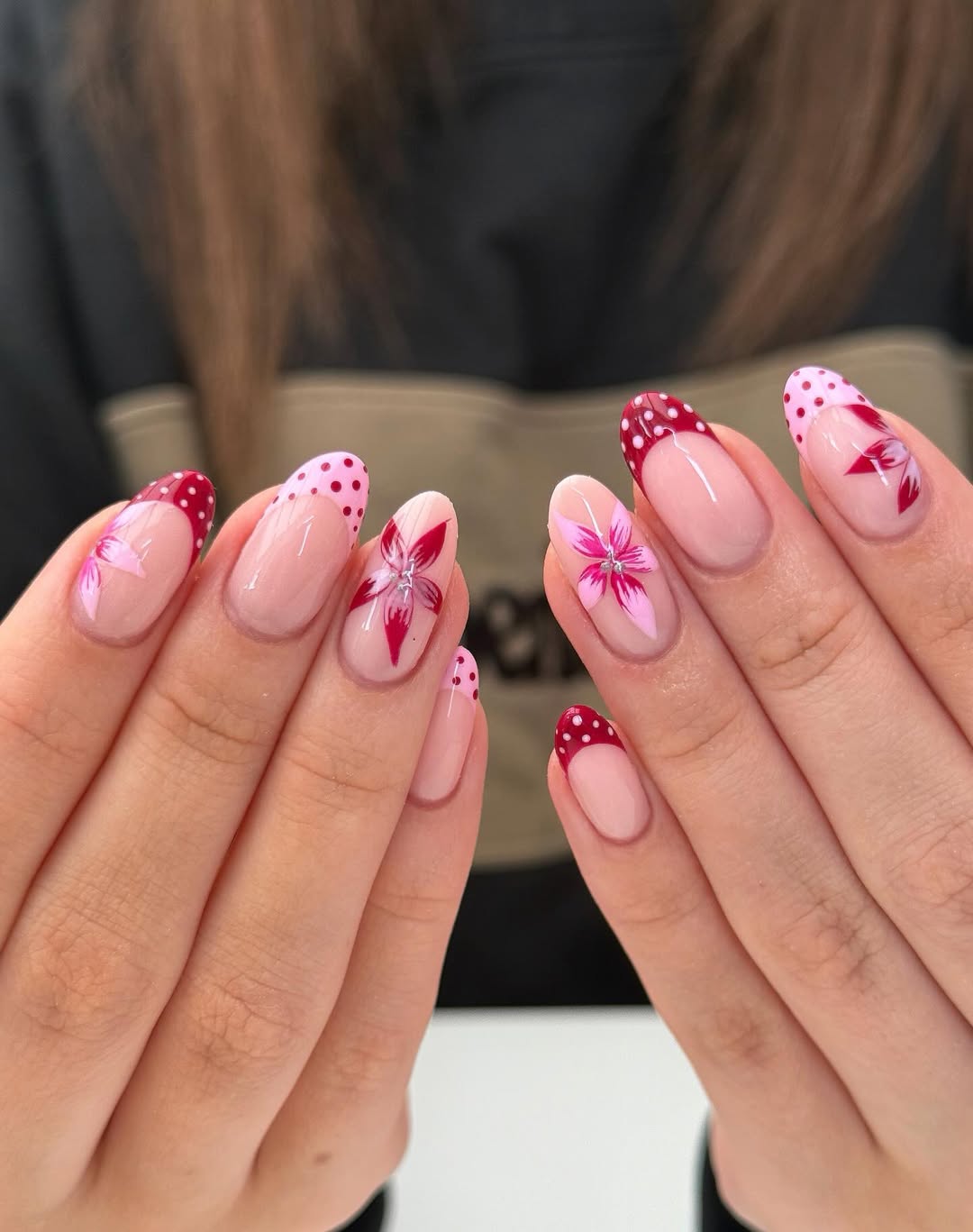 Whimsical Pink and Red Floral French Tip Almond Nails