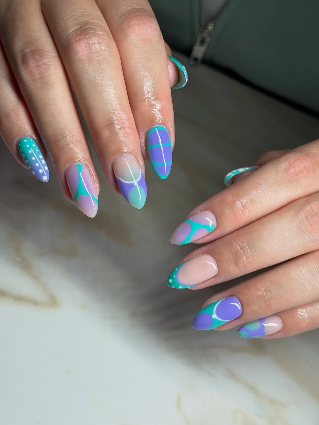 Whimsical Purple and Teal Swirl Almond Nails