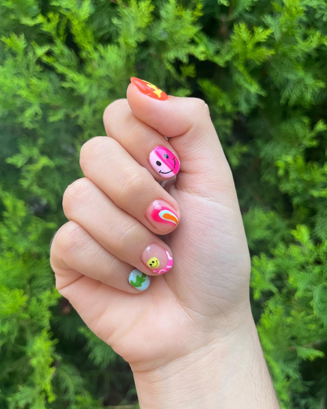 Whimsical Rainbow Swirls And Happy Face Nails