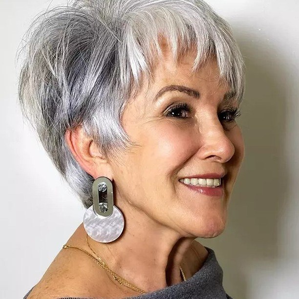25 Stunning Hairstyles for Older Women in 2026 10 Ageless Gray Pixie With Textured Bangs