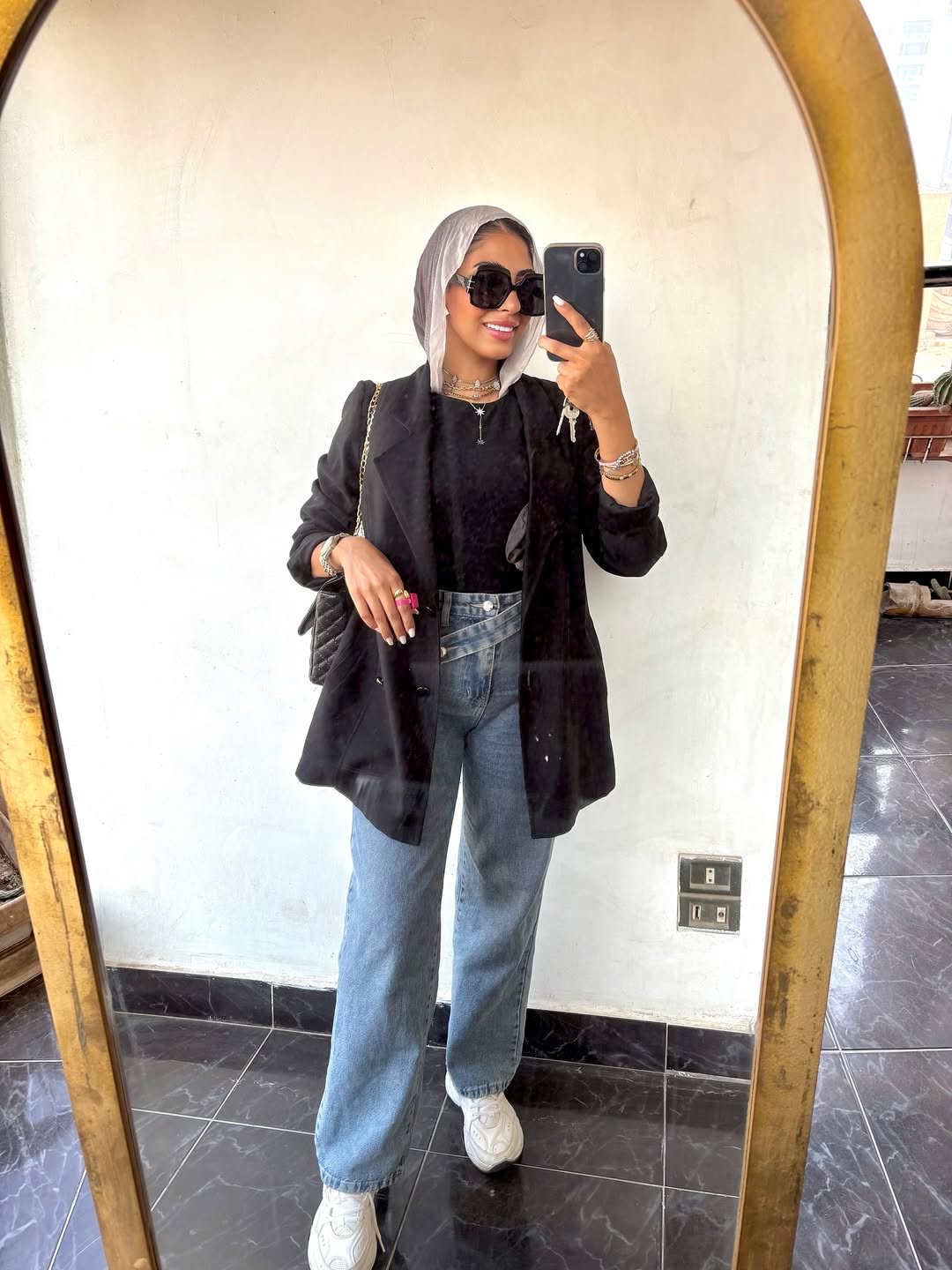 29 Work Outfits You Need for 2026 Trends 9 Black Blazer With Wide Leg Jeans And Sneakers