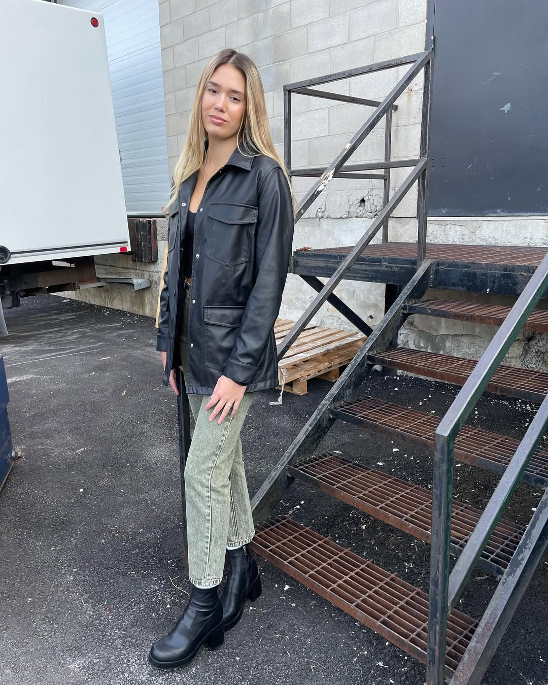 27 Fall Boot Outfit Ideas You Need Now 13 Black Faux Leather Jacket With Washed Green Denim