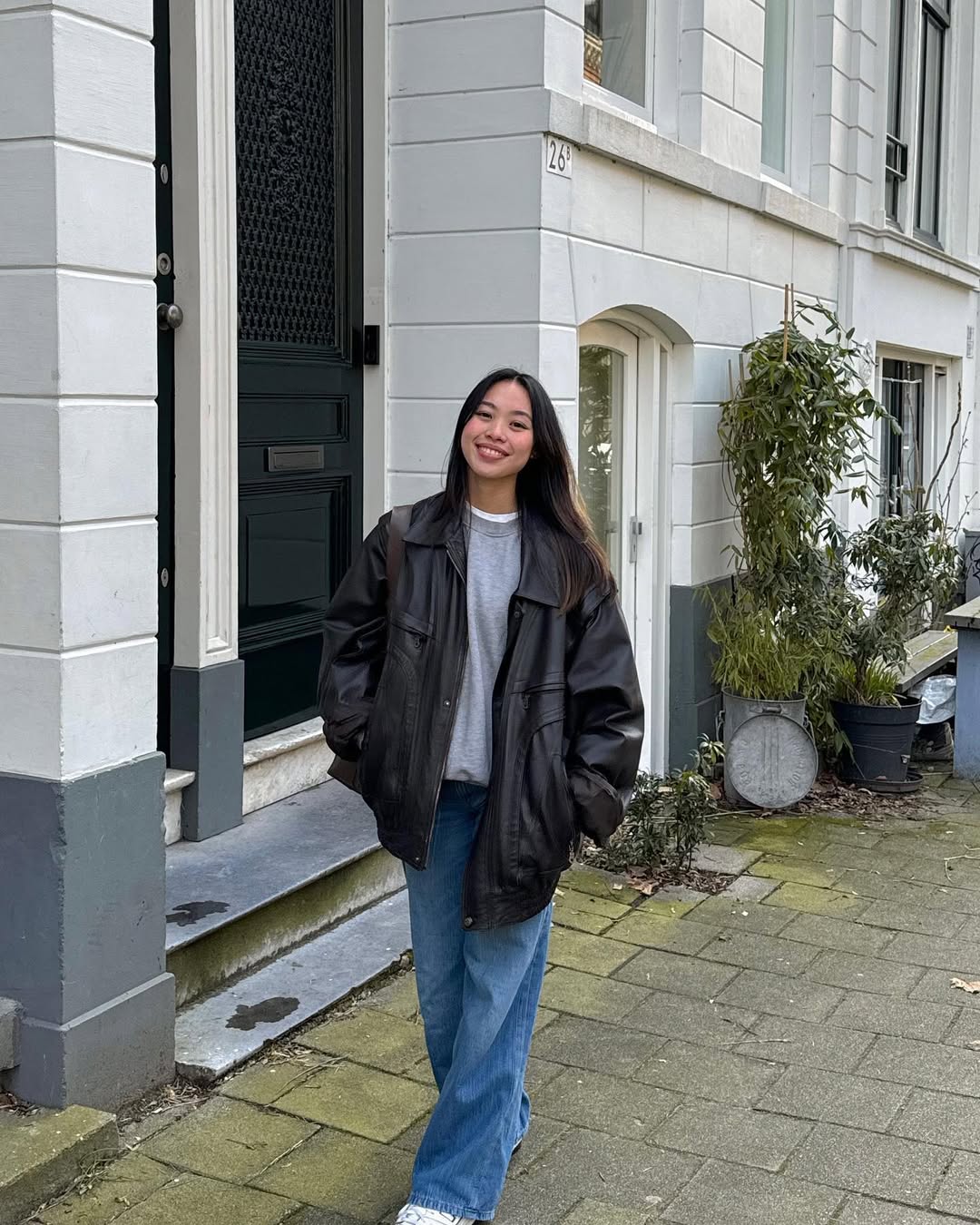 25 Epic School Outfit Ideas for 2026 You Need Now 5 Black Leather Jacket With Relaxed Jeans and Sneakers