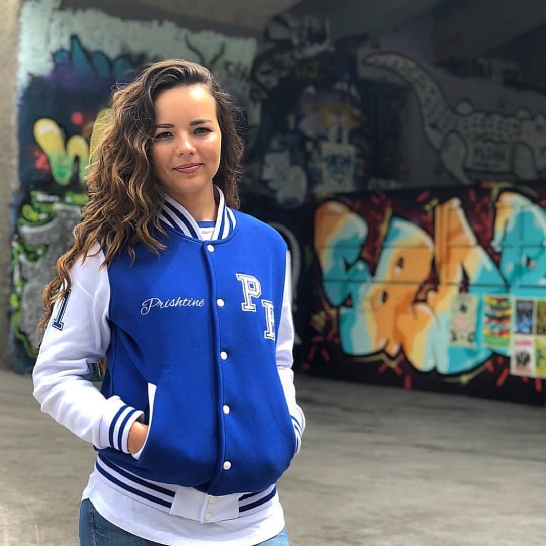 Blue Varsity Jacket With White Shirt And Denim