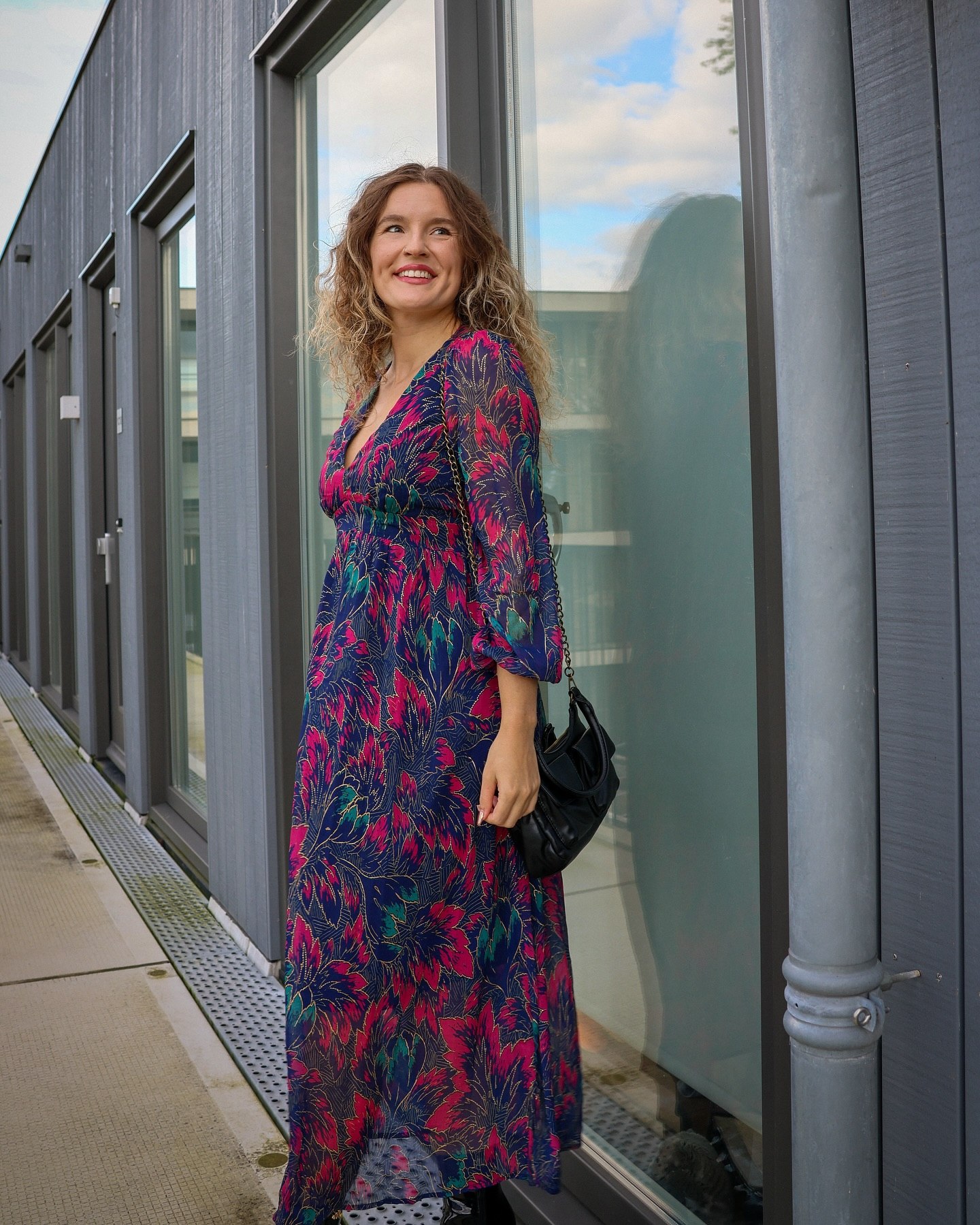 25 Fall Dress Outfits You Need For 2026 16 Bold Floral Maxi Dress With Black Accents