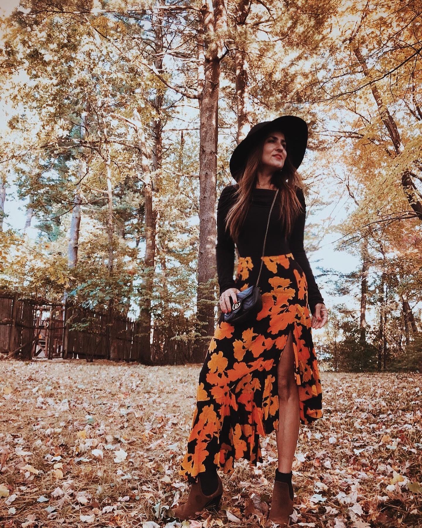 29 Chic Fall Skirt Outfits You Need for 2026 17 Bold Floral Maxi Skirt With Ankle Boots