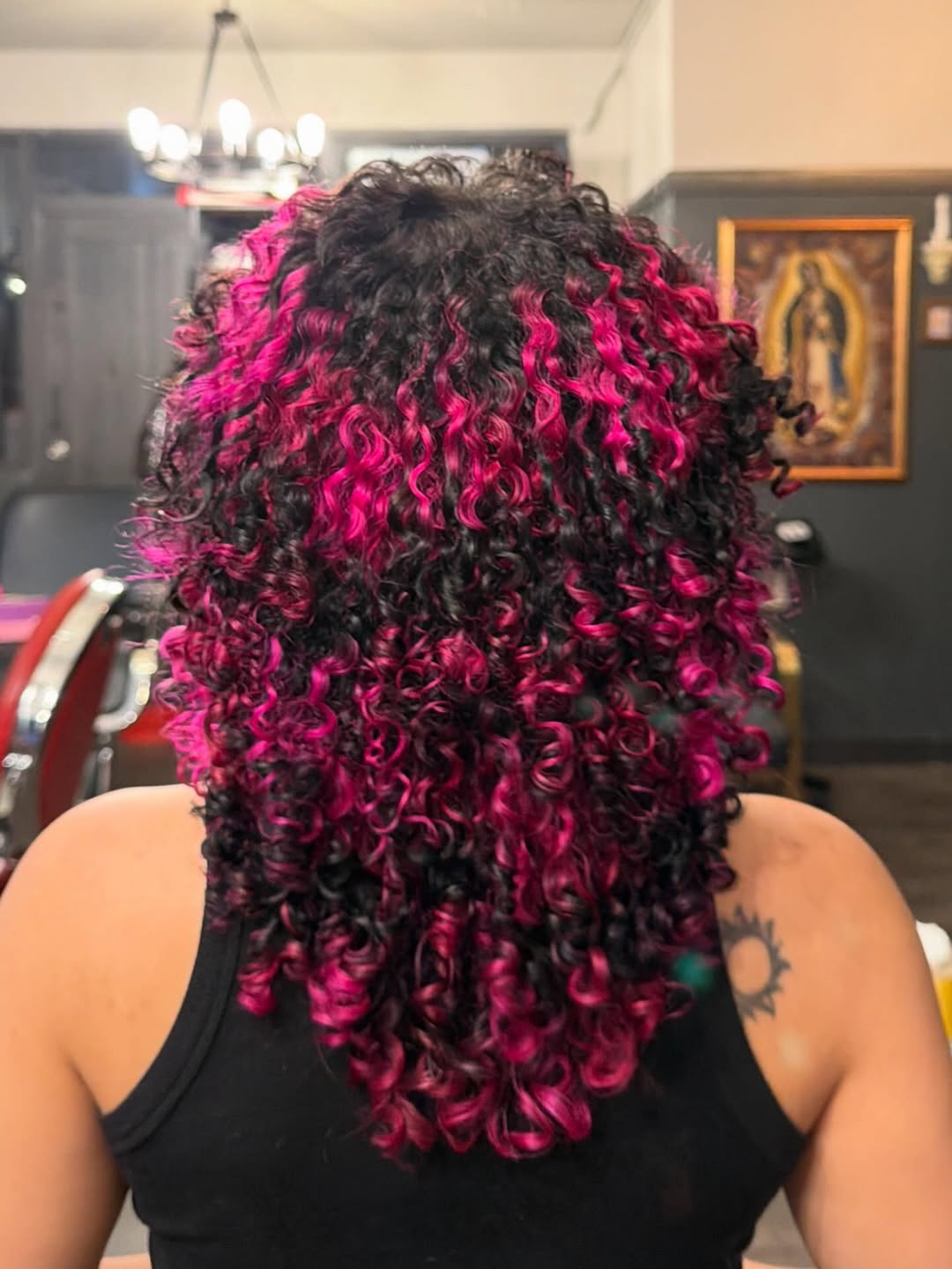 Bold Fuchsia Highlights On Shoulder Length Curls
