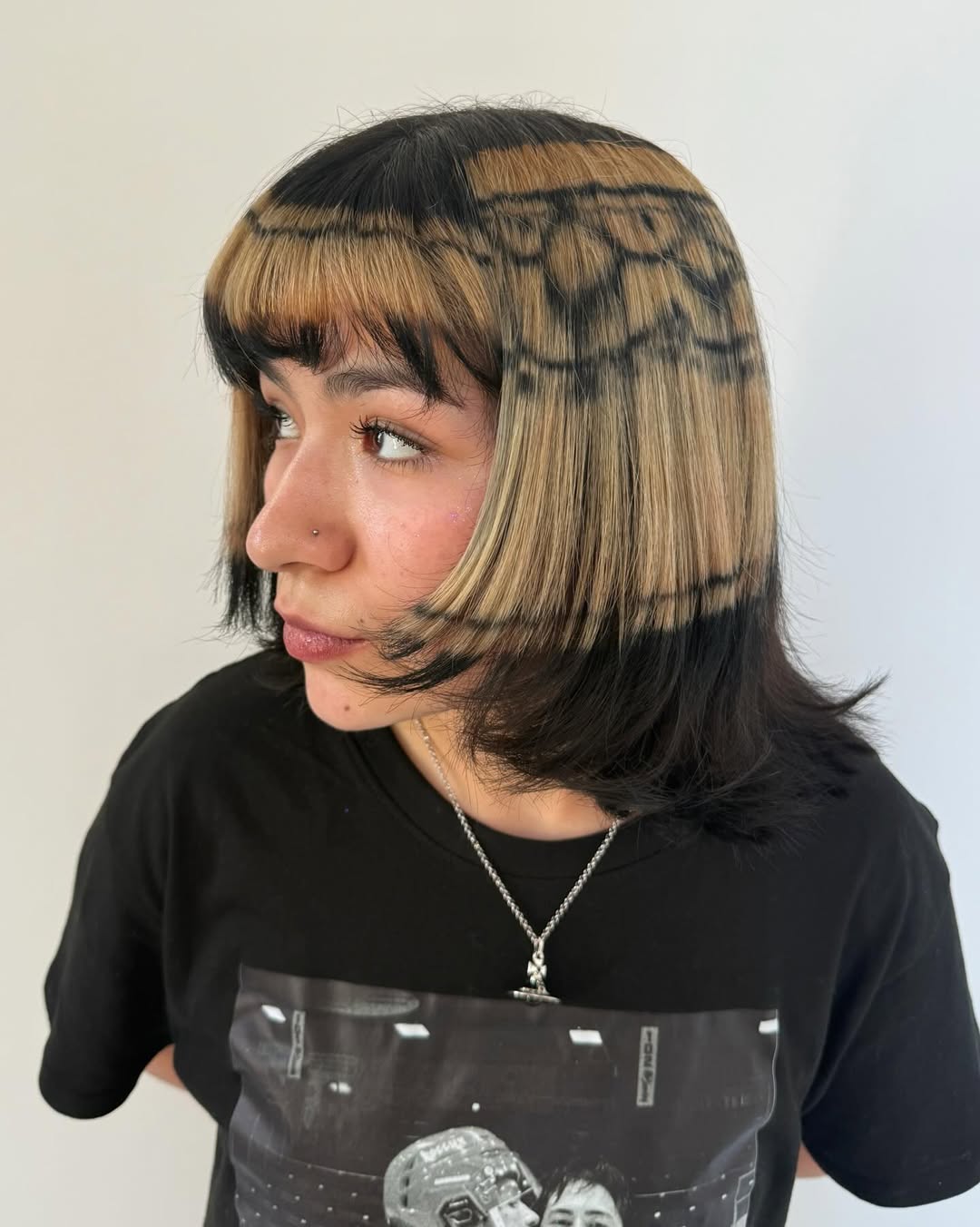 Bold Patterned Blonde And Black Bob With Bangs