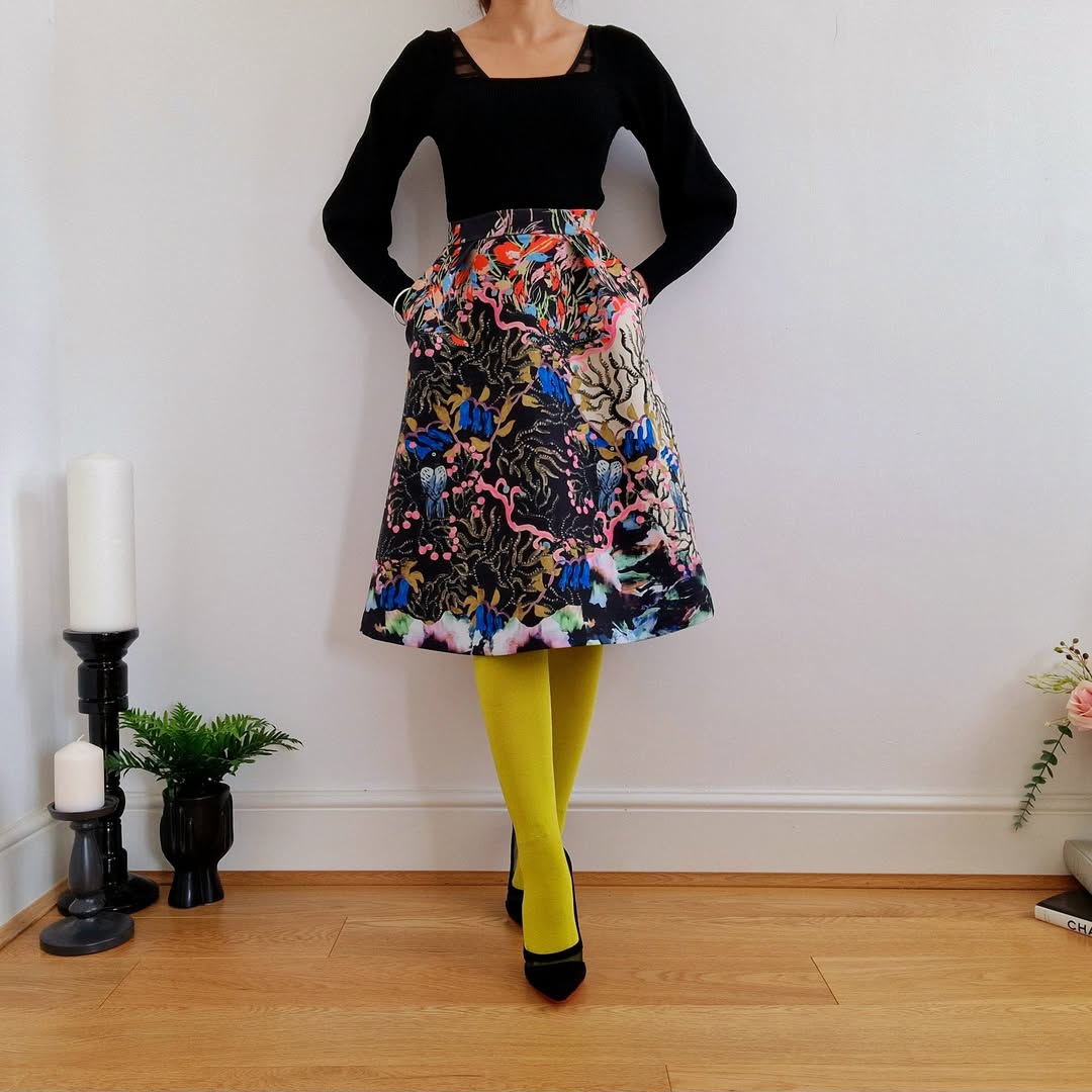 25 Dress with Tights Trends You Must See for 2026 13 Bold Patterned Midi Skirt With Bright Tights