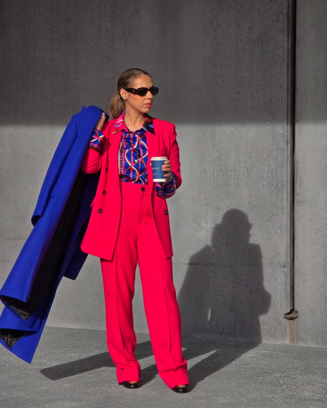 29 Work Outfits You Need for 2026 Trends 25 Bold Pink Power Suit With Contrasting Cobalt Coat