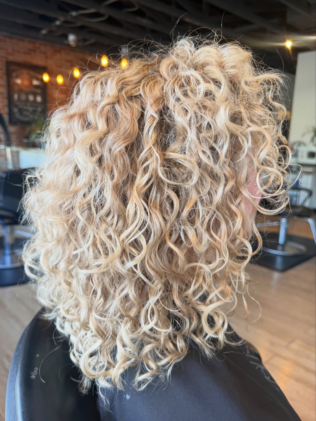 Bouncy Curly Bob On Dimensionally Blonde Hair