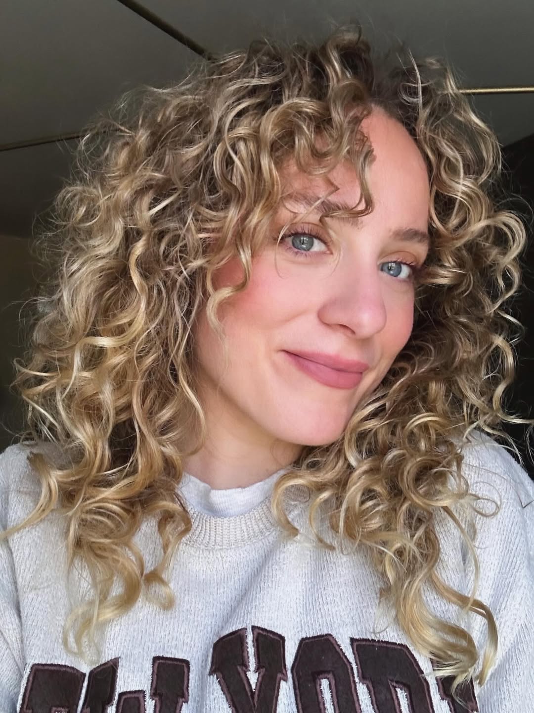 Bouncy Golden Blonde Curls With Face-Framing Layers
