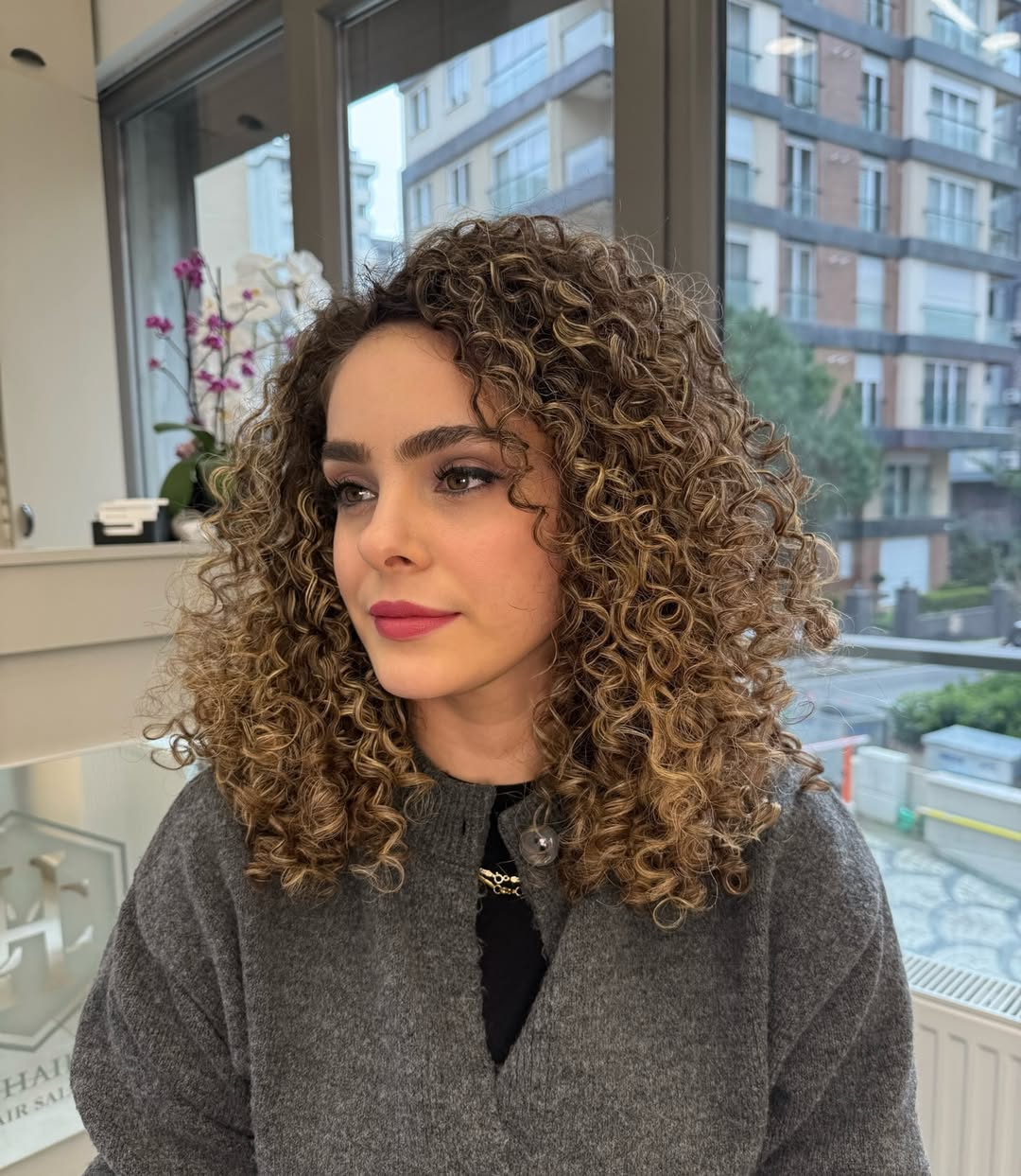 Bouncy Light Brown Curly Bob With Highlights