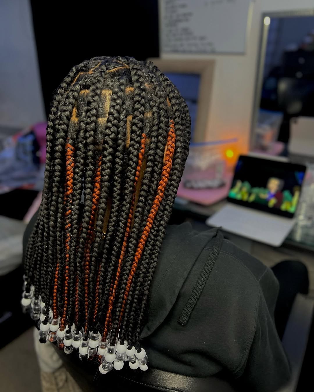 Box Braids With Orange Accents And Clear Beads