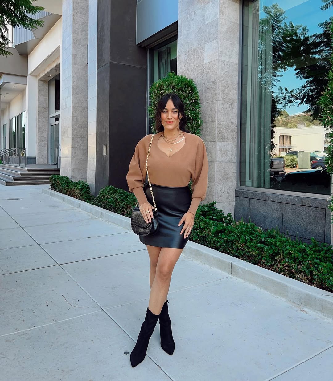 25 Early Fall Outfits You Need for 2026 9 Brown Knit Top With Black Leather Mini Skirt