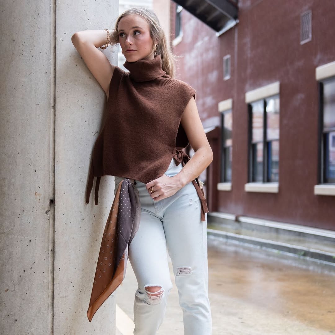 25 Fall Transition Outfits You Need for 2026 21 Brown Knit Turtleneck Vest With Light Wash Jeans