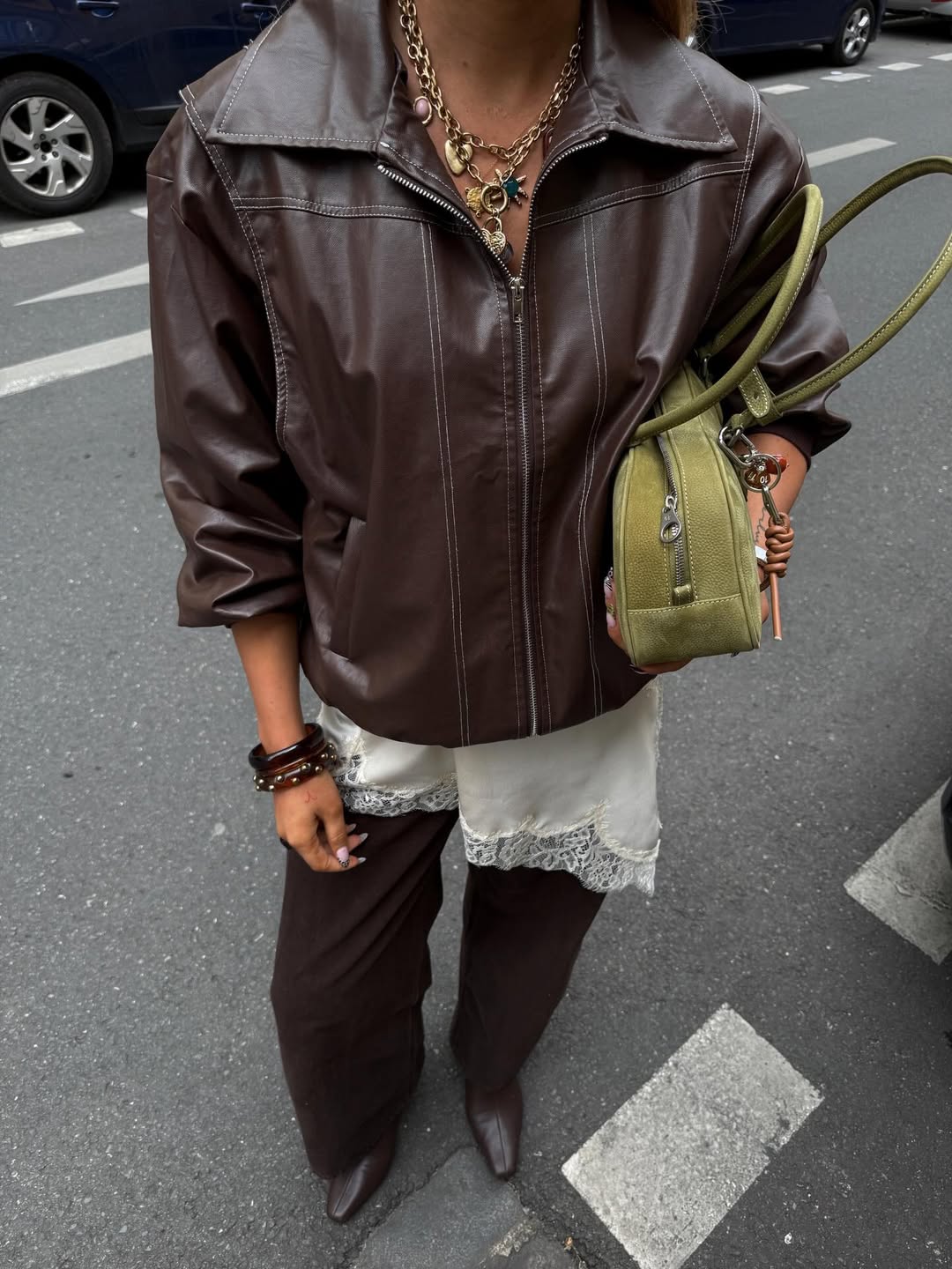 25 Fall Going Out Outfits You Need for 2026 5 Brown Leather Jacket Over Lace Trim Slip Dress