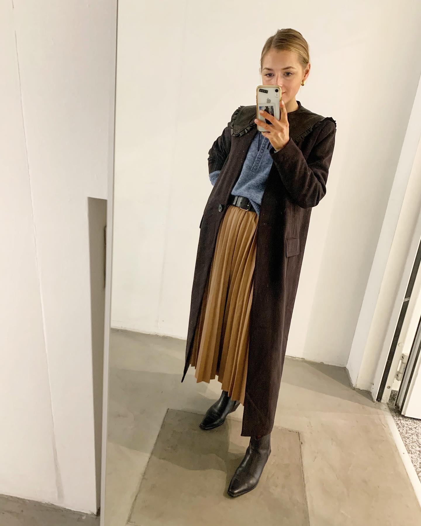 29 Chic Fall Skirt Outfits You Need for 2026 18 Brown Maxi Coat Over Pleated Midi Skirt