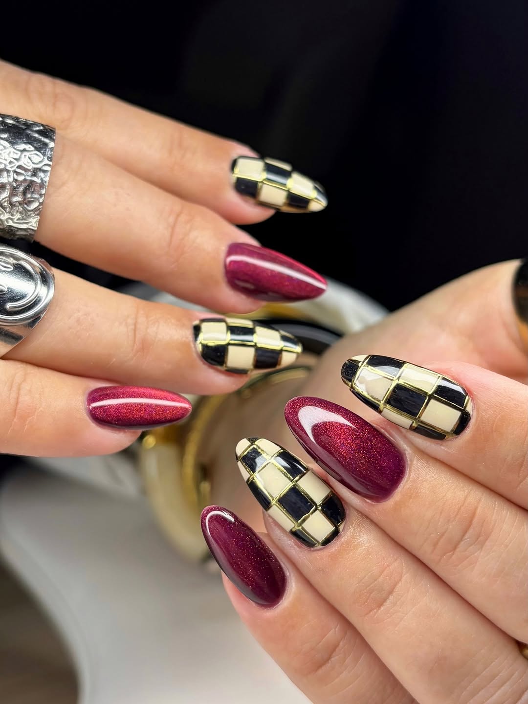 29 Checkerboard Nail Ideas for 2026 25 Checkerboard Glam Deep Cherry Cat Eye Nails