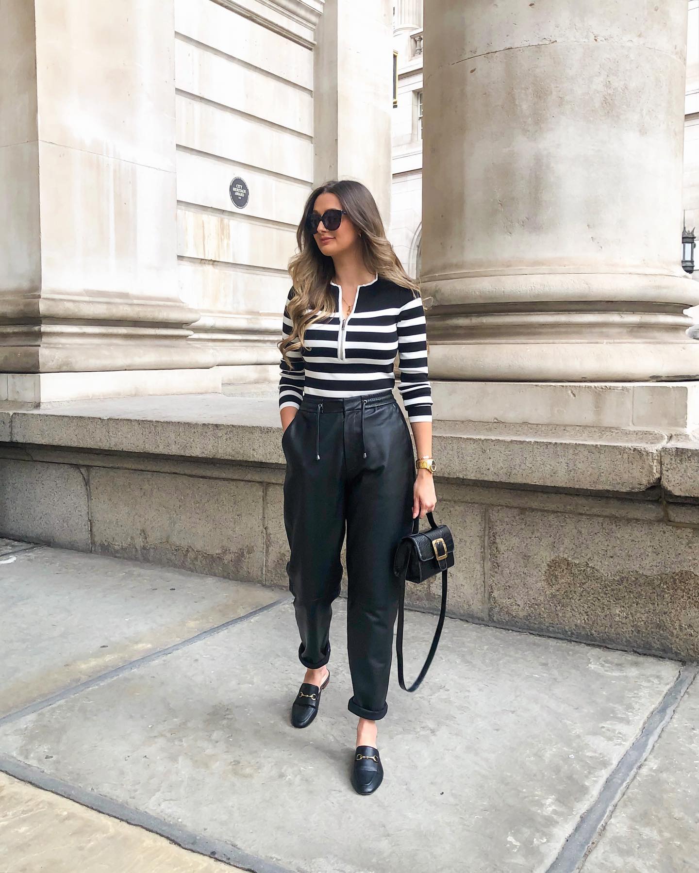25 Fall Going Out Outfits You Need for 2026 19 Chic Black Leather Trousers With Striped Zip-Up Top