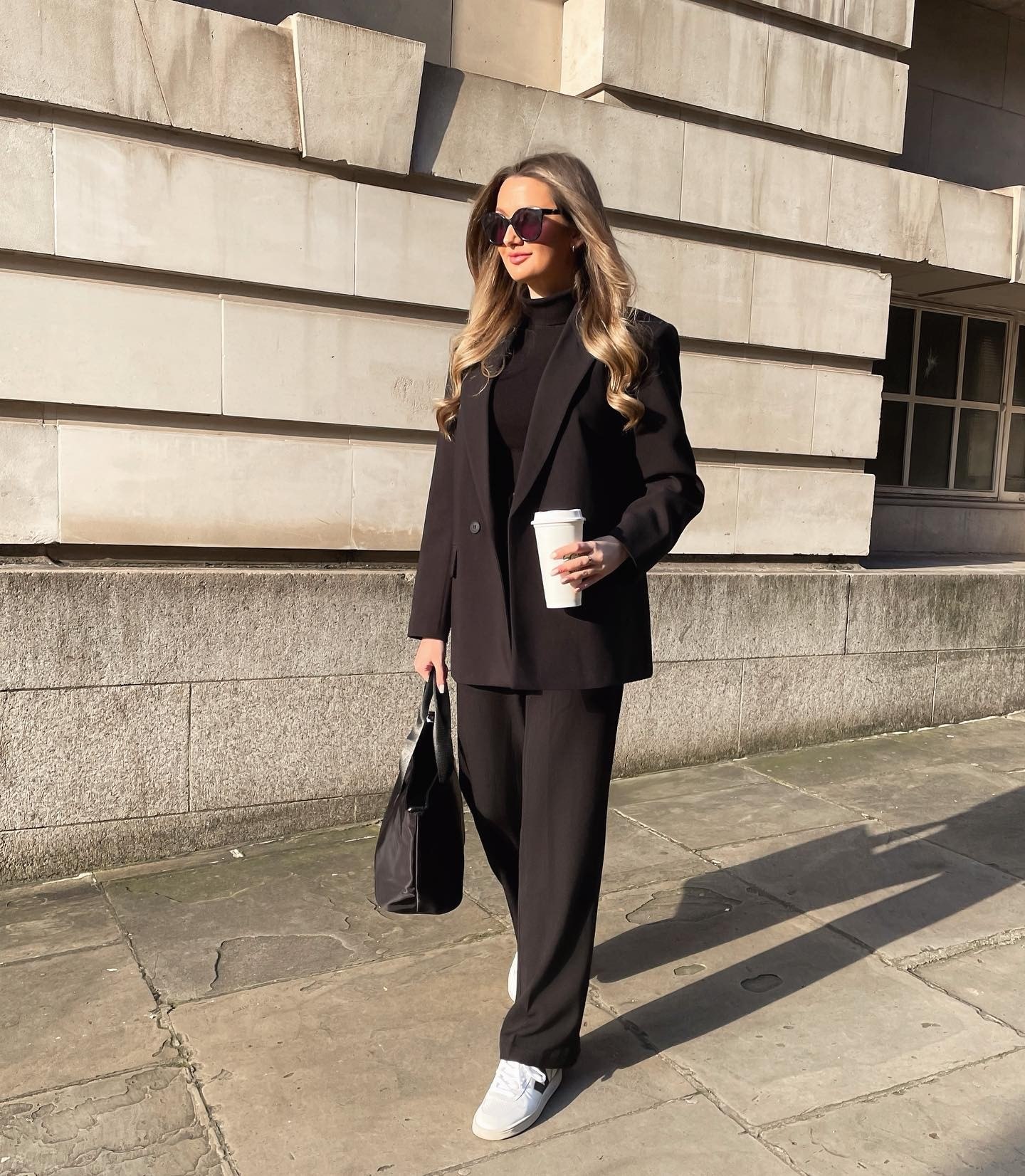 25 Fall Going Out Outfits You Need for 2026 24 Chic Black Relaxed Suit With White Sneakers