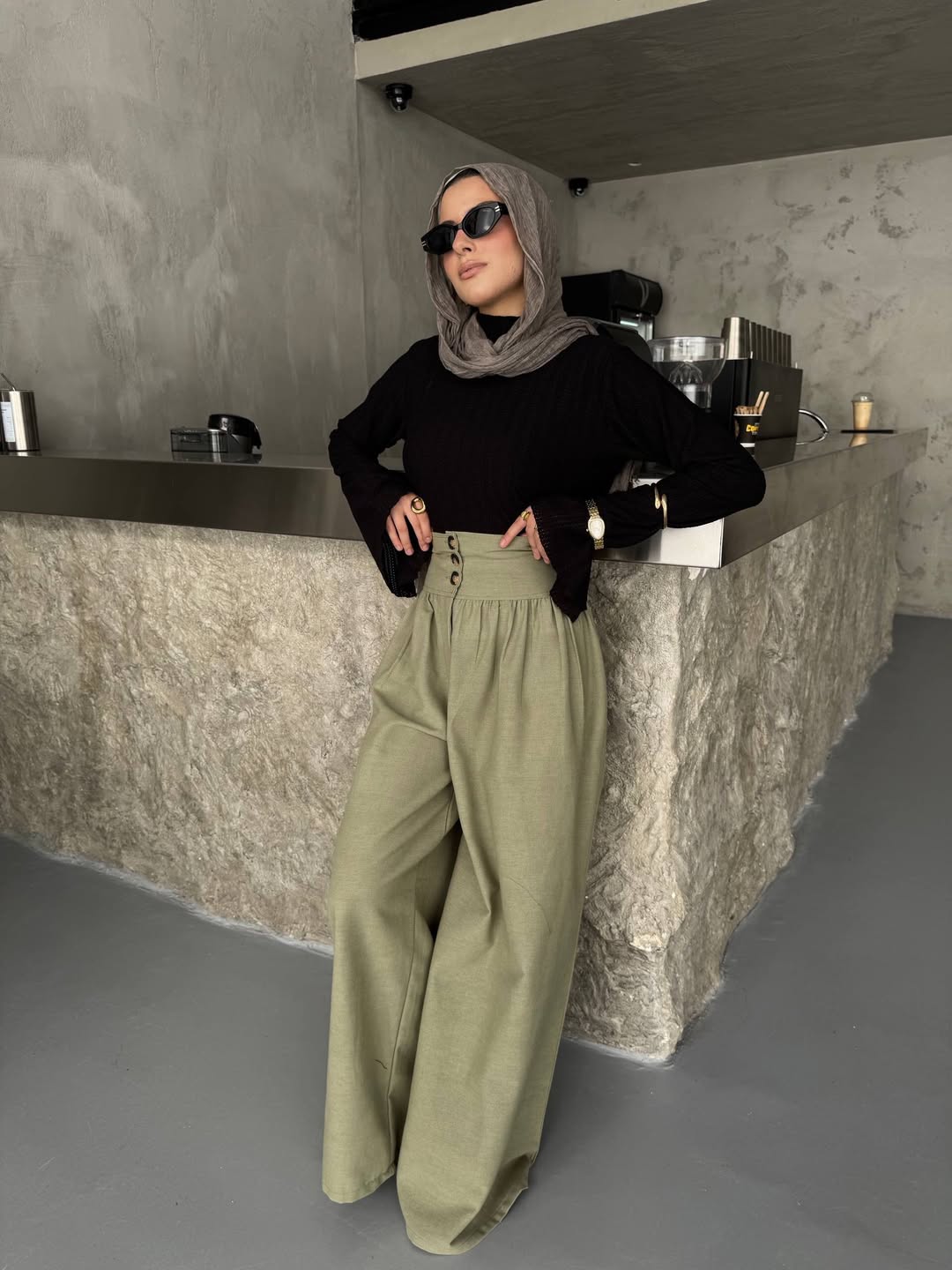25 Fall Going Out Outfits You Need for 2026 11 Chic Black Ribbed Top With Olive Wide Leg Trousers