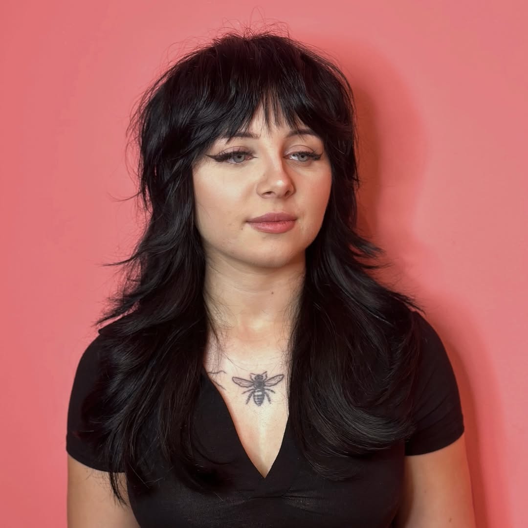 Choppy Jet Black Wolf Cut With Wispy Bangs