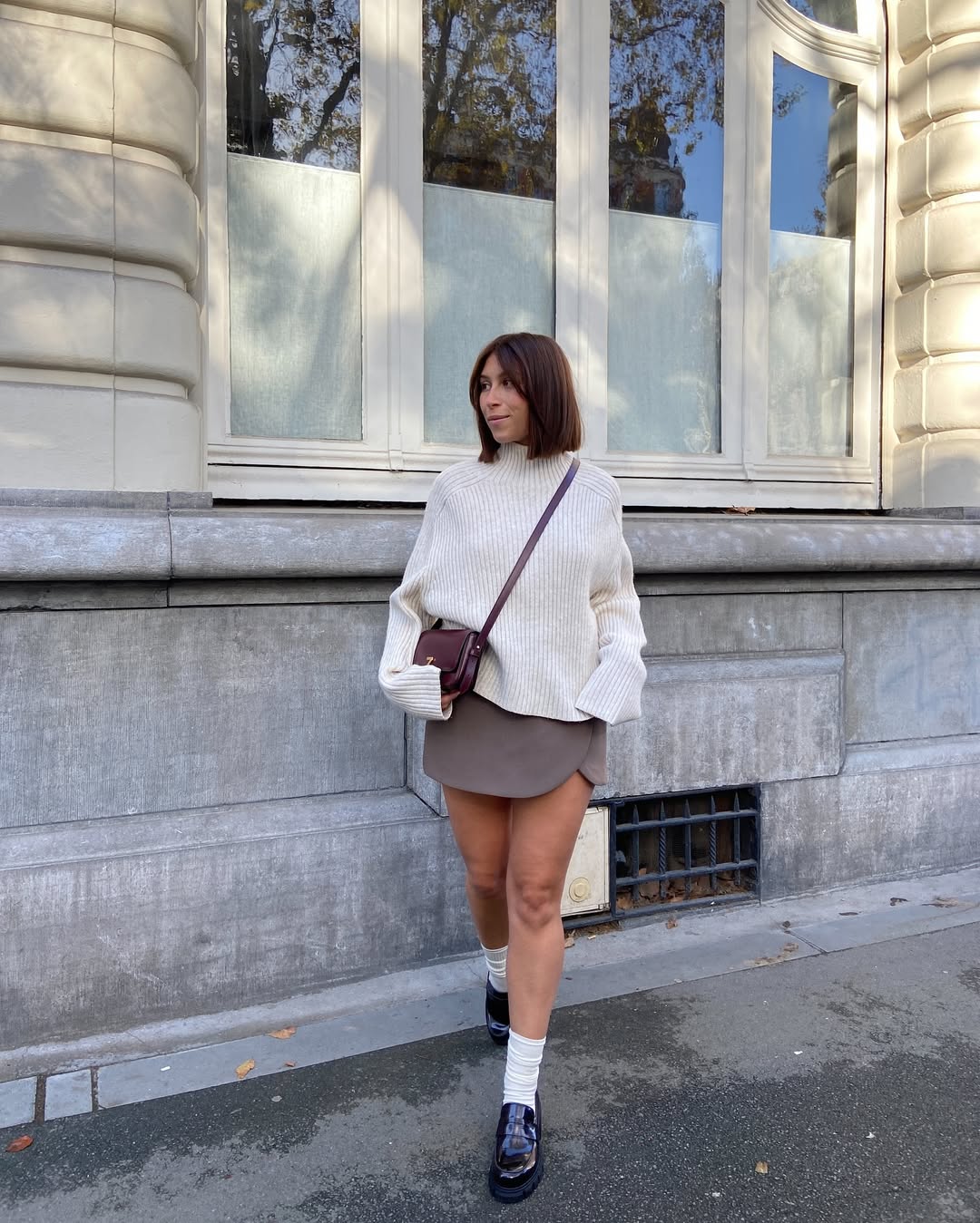 30 Chic Fall Outfits Women Will Love in 2026 5 Cozy Cream Knit With Brown Skort For Fall